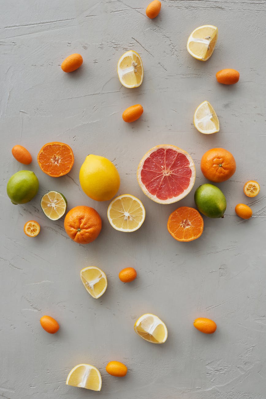 sliced citrus fruits on table