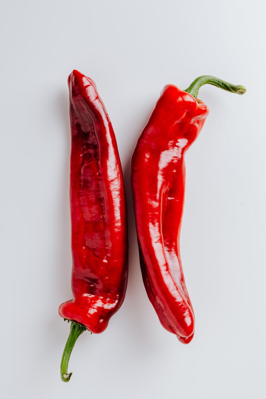 red chili on white surface